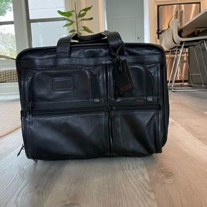 Tumi Luggage Carry-on black leather expandable 2 wheel rolling